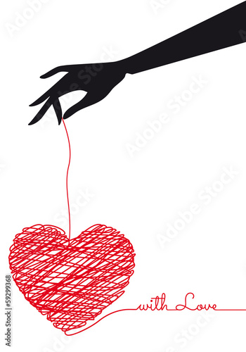 Obraz w ramie Ręka trzymająca czerwone serce na sznurku