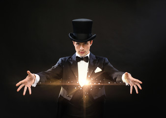 magician in top hat showing trick