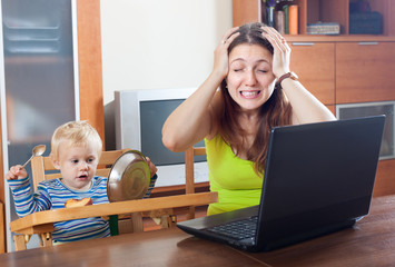 Young mother working at home