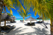 Lounge chairs with umbrellas on white sand beach, Mauritius