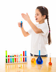 girl sniffs a chemical reagent