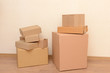 © Africa Studio - Empty room with stack of cartons: moving house concept