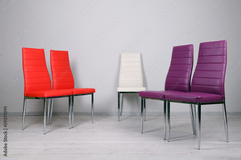 Modern  color chairs on wall background