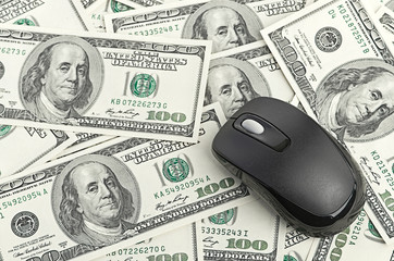 US Dollars and Computer Mouse