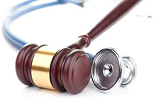 Brown Gavel And A Medical Stethoscope