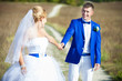 © A.Kazak - happy bride and groom at a park on their wedding day