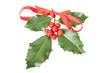 Holly with red ribbon on white, clipping path