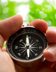 Wall Mural - Hand holding compass