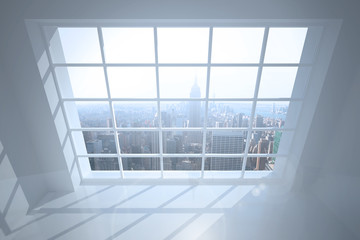 Room with large window showing city