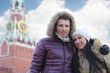 © Pavel Losevsky - Young man and woman stand near Spasskaya tower on Red Square
