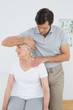 © lightwavemedia - Senior woman getting the neck adjustment done