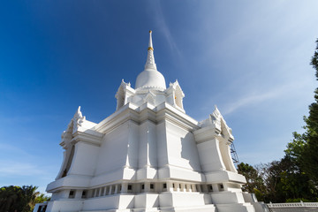 white pagoda with blue sky