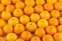 Many Ripe Orange Tangerines As Background Closeup