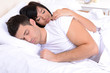 © Africa Studio - Couple in love sleeping in bed