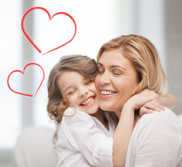 Canvas Print - smiling mother and daughter hugging