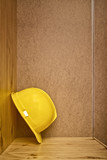 Fototapeta Nowy Jork - Construction helmet in wooden cabinet