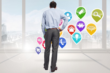 Poster - Composite image of businessman with hand on hip