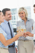 © WavebreakmediaMicro - Business team toasting with champagne in office
