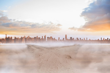 Poster - Sandy path leading to large urban city