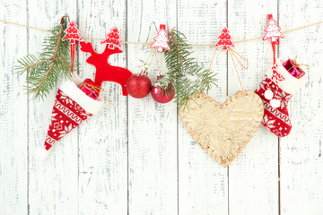 Wall Mural - Christmas accessories hanging on white wooden wall