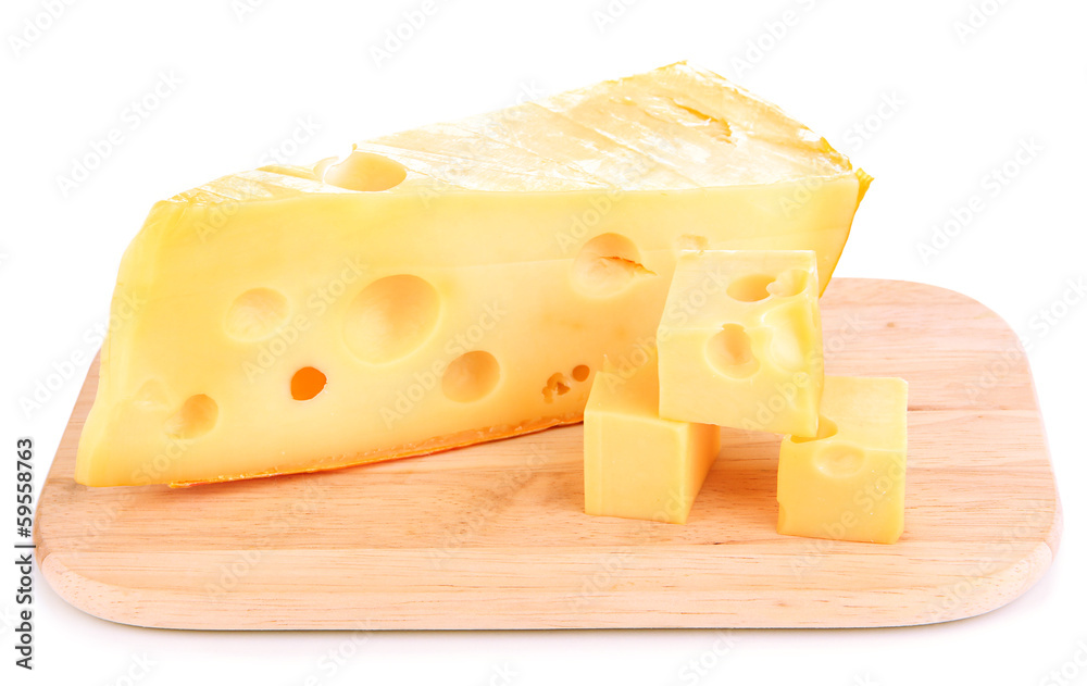 Cut cheese on wooden board isolated on white