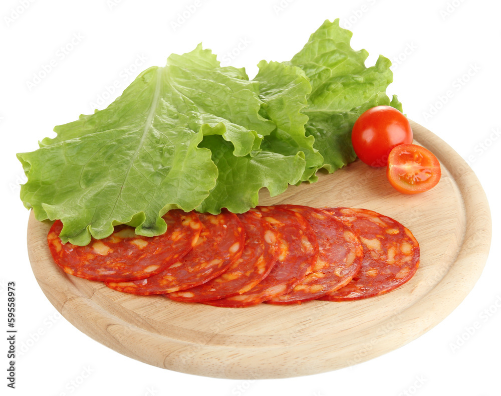 Salami slices on wooden board, isolated on white