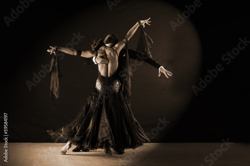 Fotografie, Obraz Latino dancers in ballroom against white background