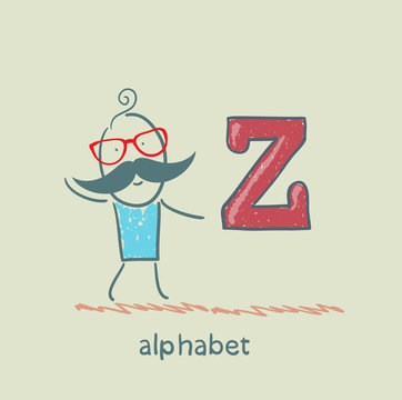 man standing with a letter of the alphabet
