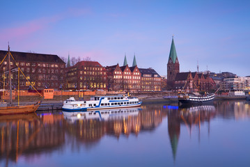Fototapete - sunset over river in Bremen city