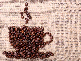 Coffee Beans, placed in shape of cup on burlap