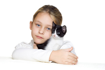 Wall Mural - little girl tenderly embraces a kitten