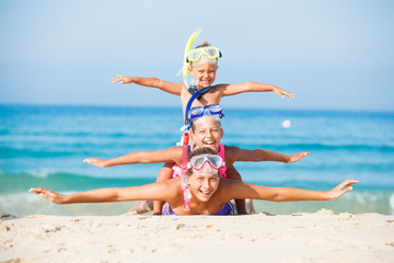 Wall Mural - three happy children on beach...