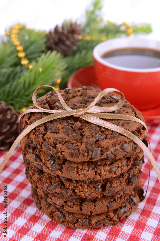 Sweet cookies with cup of tea on table close-up