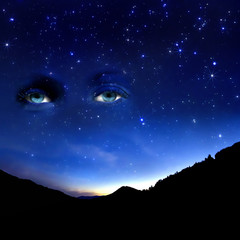 Wall Mural - starry sky and a view of a female eye.
