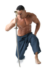 Muscular Man Kneeling Shirtless, With Japanese Sword