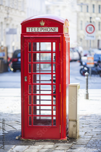 Naklejka dekoracyjna Red public phone on one of the streets of Vienna, Austria.