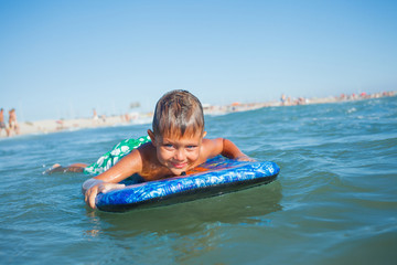 boy has fun with the surfboard