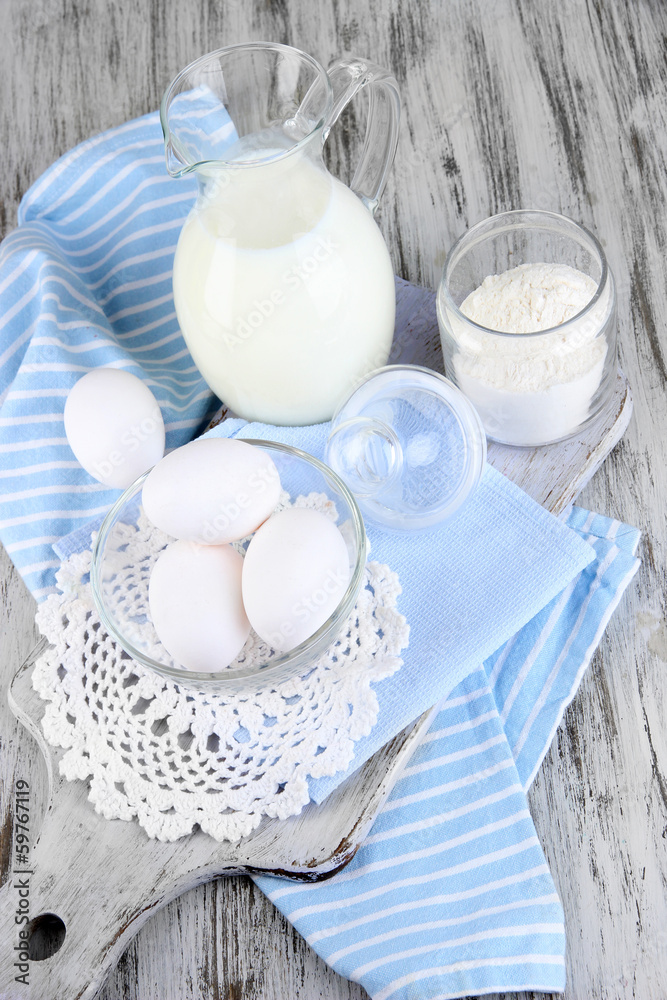 Ingredients for dough on wooden table close-up