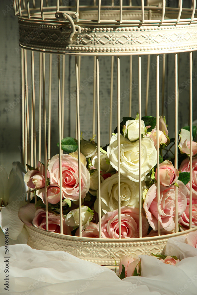 Beautiful decorative cage with beautiful flowers