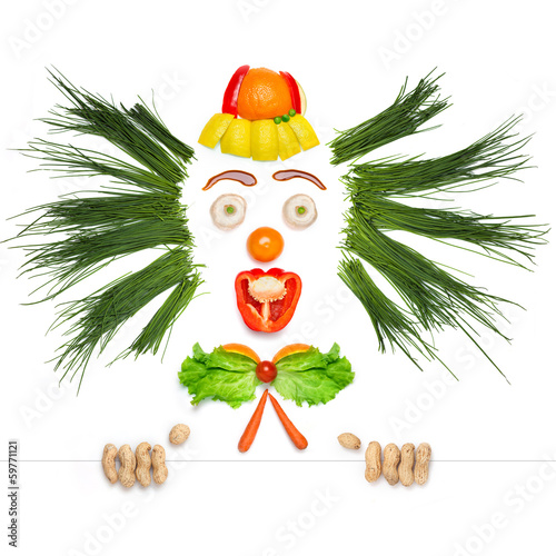 Nowoczesny obraz na płótnie Uśmiechnięty klaun zrobiony z warzyw i owoców