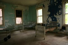 Delapidated Hospital Building With Empty Rusted Beds