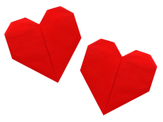 Two origami paper hearts, red isolated over white