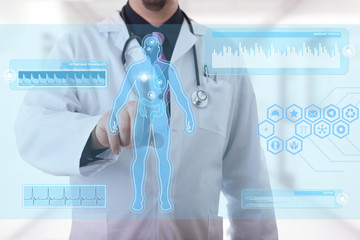 Male doctor working on a futuristic touchscreen display