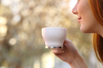 Canvas Print - Close up of a woman holding a coffee cup