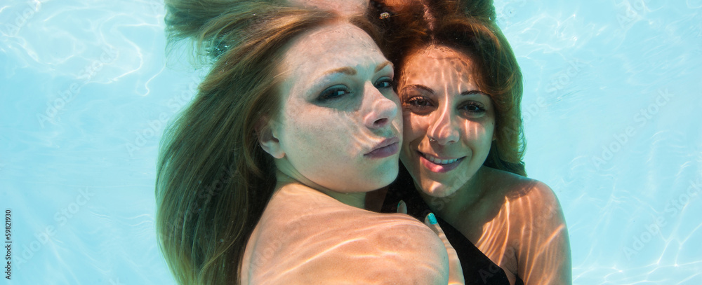 Two girls underwater close up portrait in swimming pool. Stock Photo ...