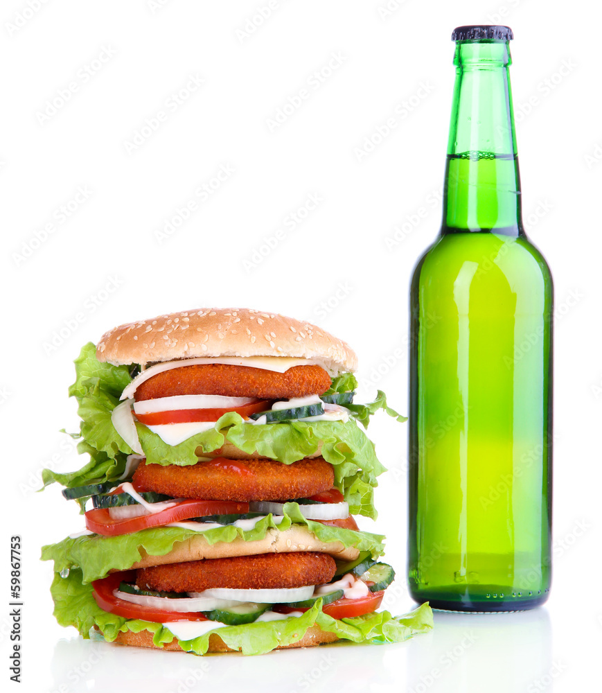 Huge burger and bottle of cold drink, isolated on white