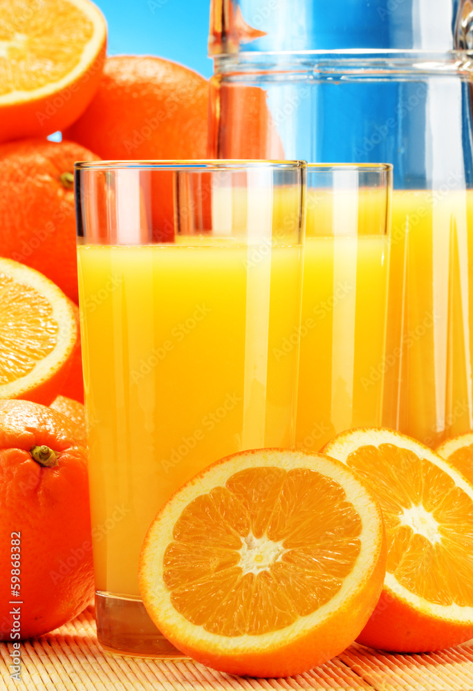 Composition with glasses of orange juice and fruits - obrazy, fototapety, plakaty 