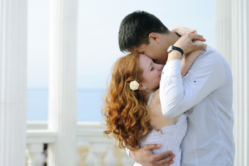 Fototapete - beautiful young couple in love near the sea