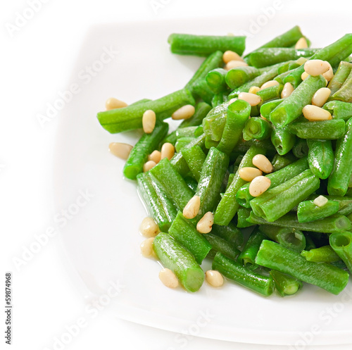 Fototapeta na szkło Fried green beans with cedar nuts