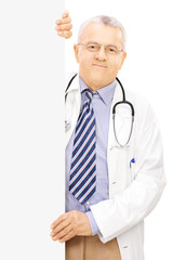 Sticker - Middle aged doctor standing next to a blank panel